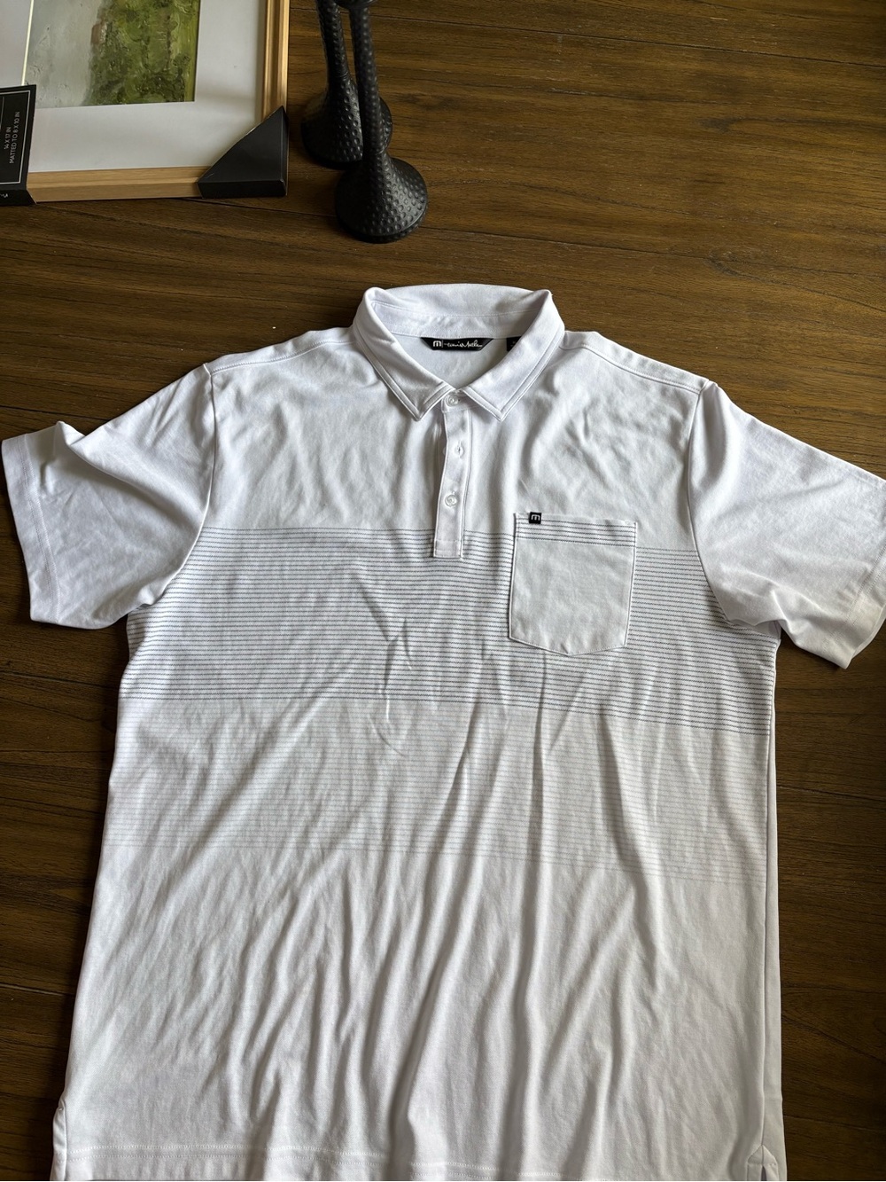 Travis Mathew White Polo with Subtle Horizontal Stripe